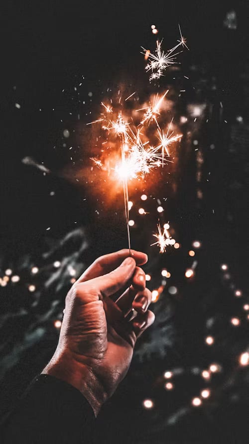 Hand holding a sparkler
